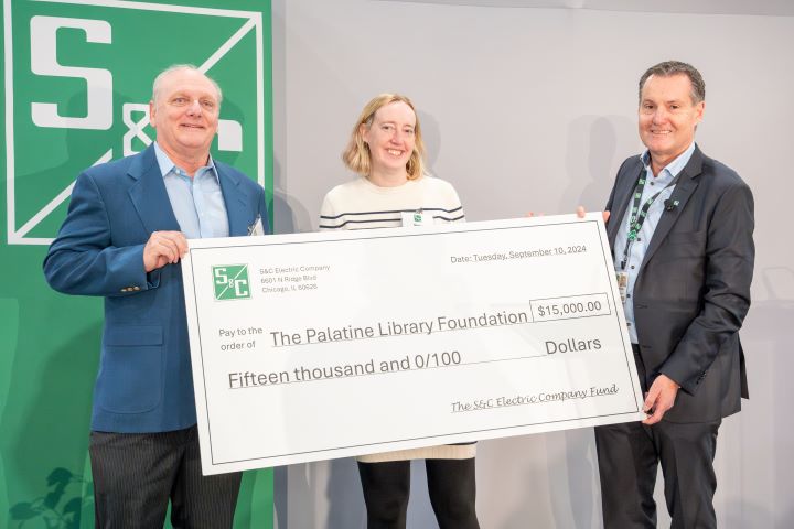 S&C CEO, Anders Sjoelin, presents a check to The Palatine Library Foundation